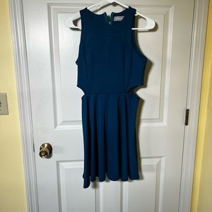 Short blue dress with side cutouts